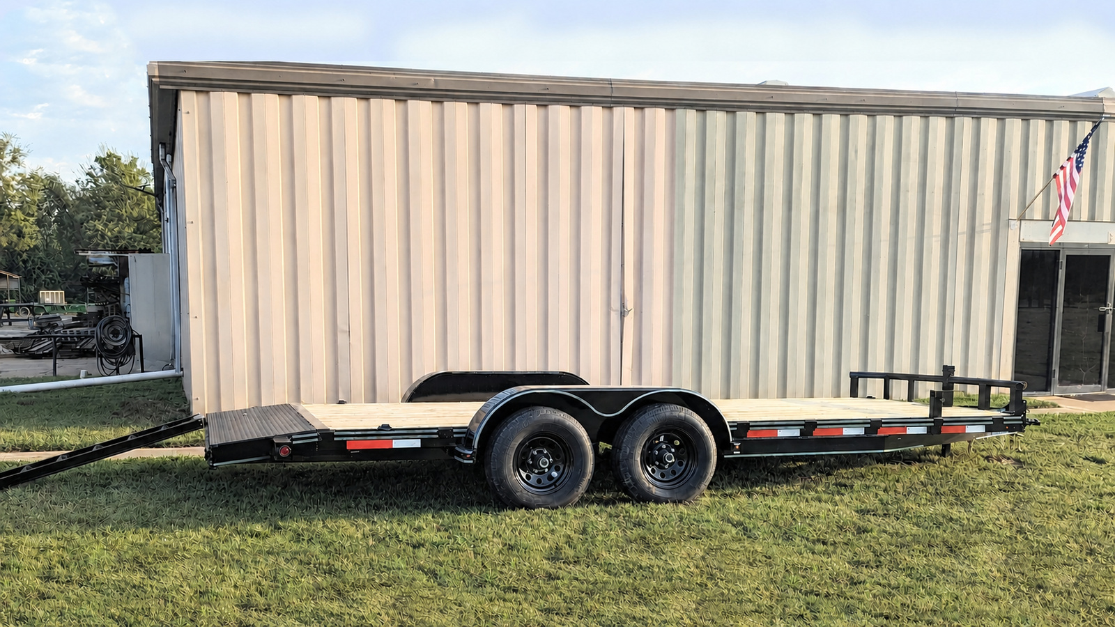 Car hauler trailer with wood floor and metal ramps